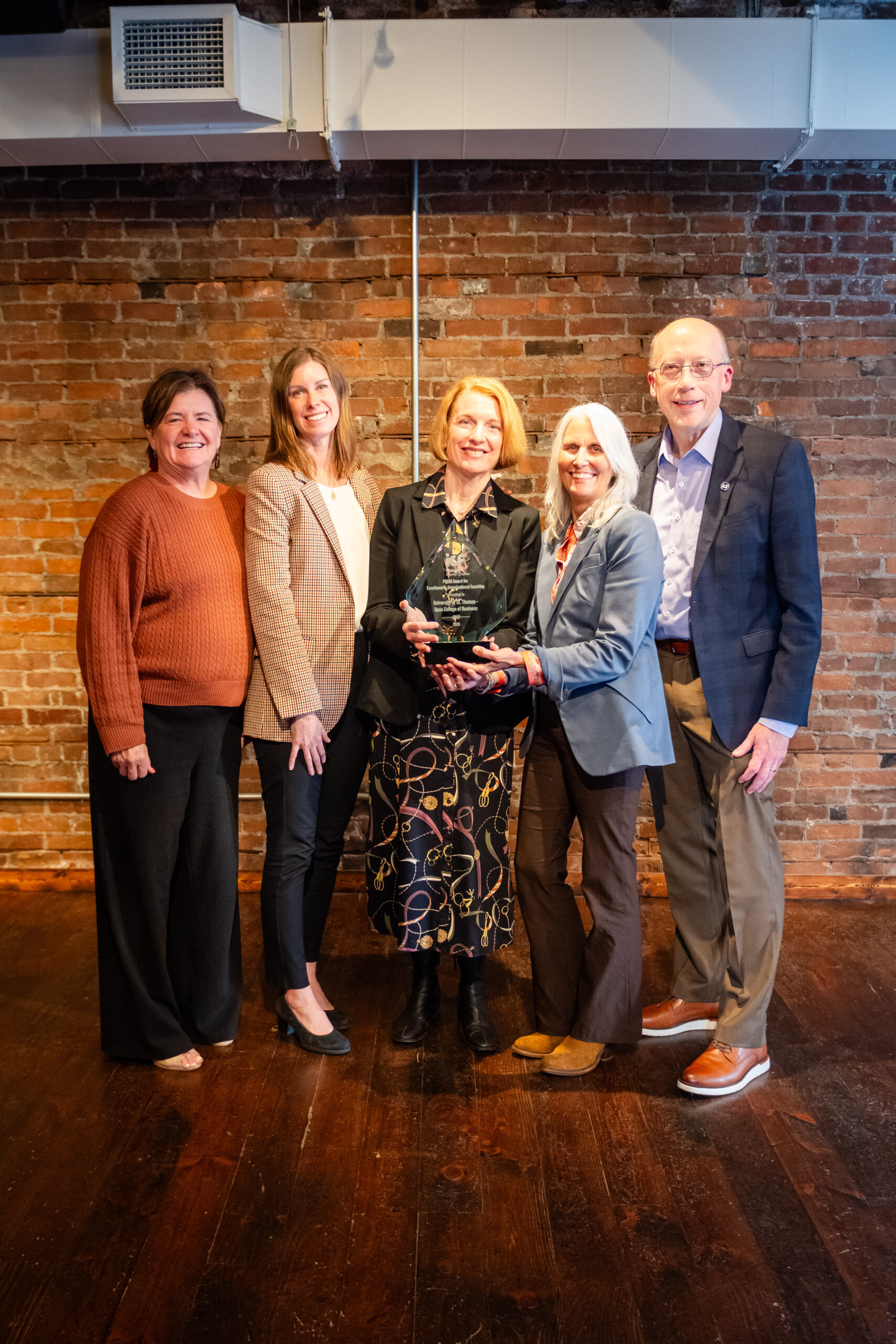 University of St. Thomas Opus College of Business team with the 2026 ICF Minnesota PRISM Award